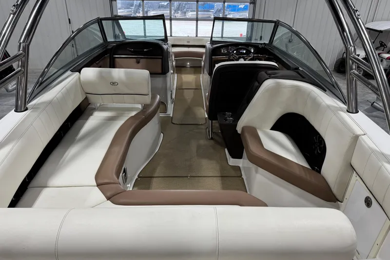 Slide: The Image of Interior of a 2014 Cobalt 276 boat with white and brown seating. - 7