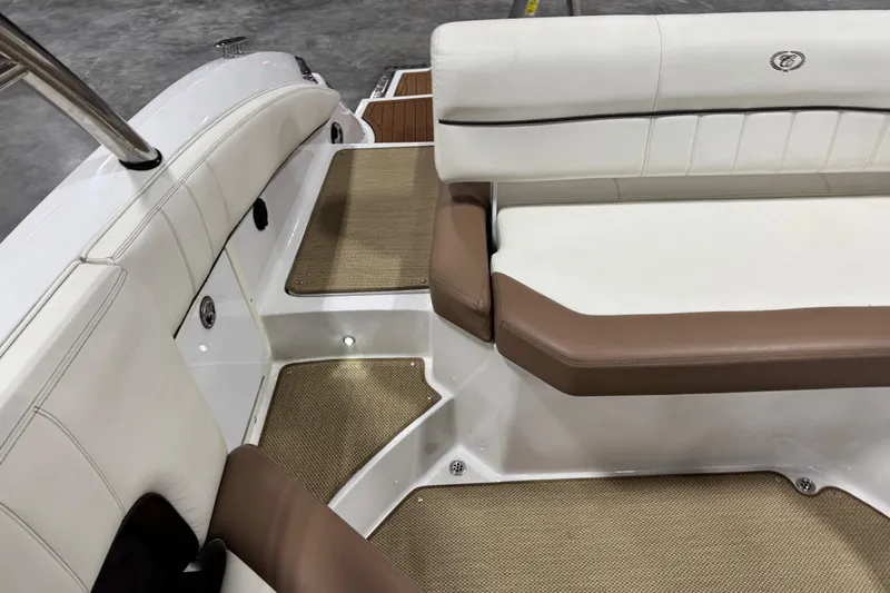 Slide: The Image of 2014 Cobalt 276 boat interior with white and brown seating, carpeted flooring. - 8