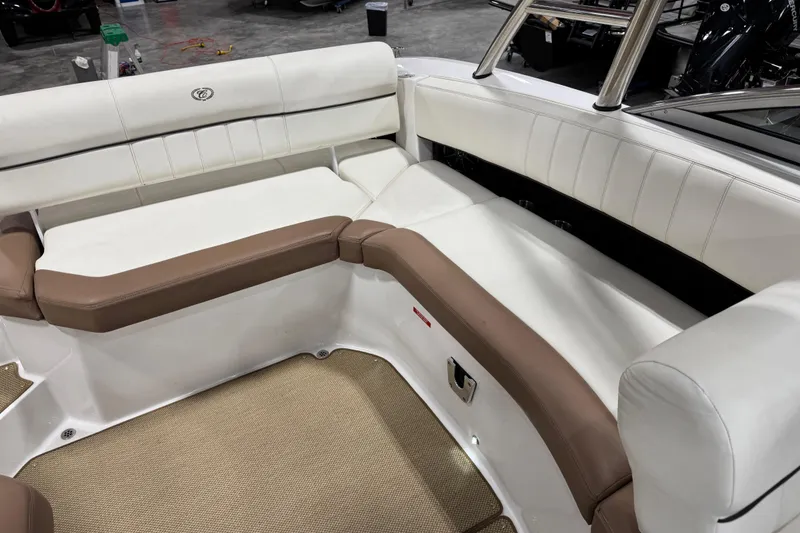 Slide: The Image of Interior seating of a 2014 Cobalt 276 boat with white and brown upholstery. - 9