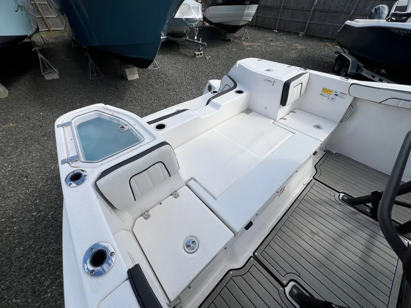 Slide: The Image of Interior of a 2023 Yamaha 255 FSH Sport E boat, white deck. - 22