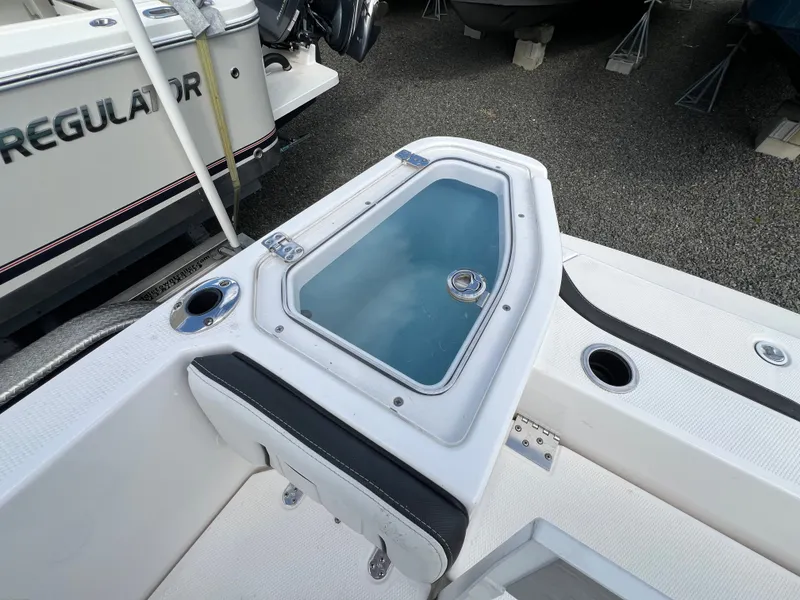 Slide: The Image of Yamaha Boats 2023 255 FSH Sport E with glass cover and seating area. - 25