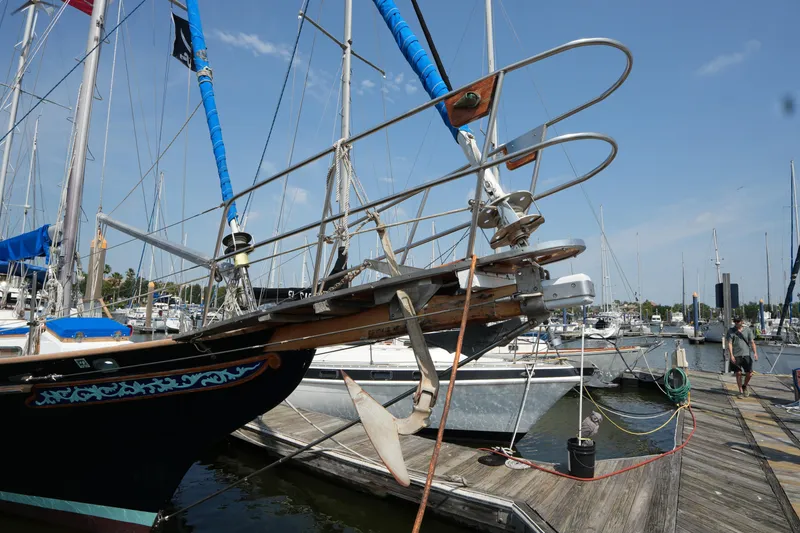 Slide: The Image of Sailboat Vagabond 47, 1982 model, docked at marina with clear blue sky. - 10
