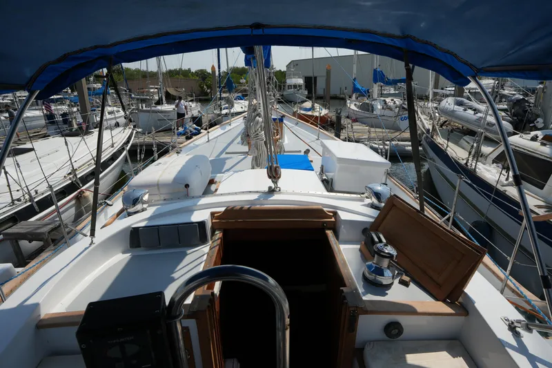 Slide: The Image of Cockpit view of 1982 Vagabond 47 sailboat docked at marina. - 18