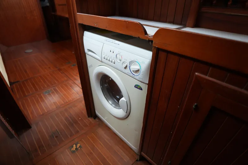 Slide: The Image of Washing machine in wooden interior of 1982 Vagabond 47 sailboat. - 39