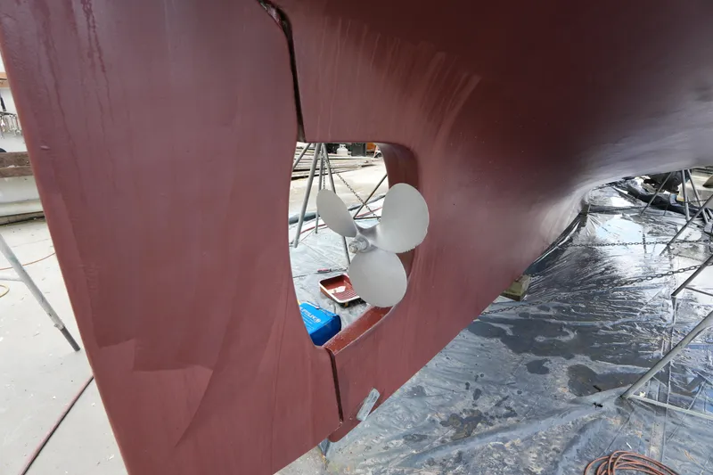 Slide: The Image of Propeller of 1982 Vagabond 47 sailboat on dry dock, undergoing maintenance. - 5
