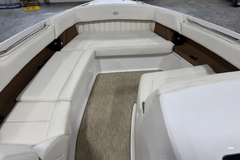 Slide: The Image of 2019 Cobalt R35 boat interior with white seating and beige flooring. - 13