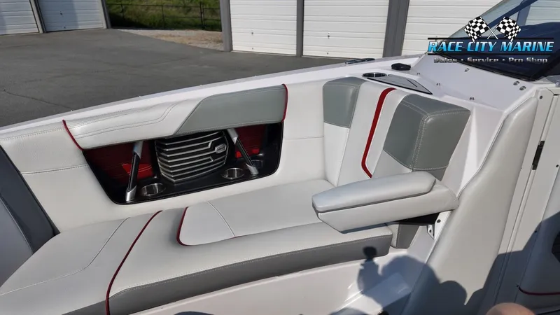 Slide: The Image of The image shows the interior of a 2013 Nautique G23 with gray and red accents. - 36