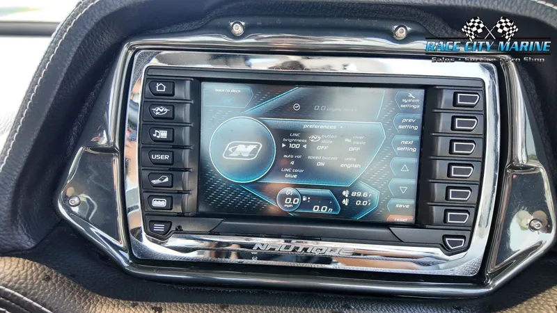 Slide: The Image of The image shows the dashboard of a 2013 Nautique G23 with a modern display. - 24