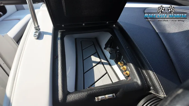 Slide: The Image of An open storage compartment on a boat with connectors and a switch. - 29