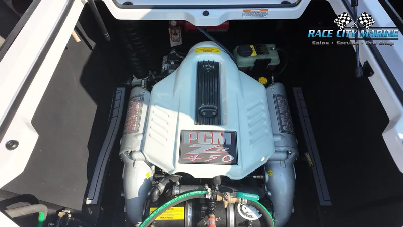 Slide: The Image of Engine compartment of a 2013 Nautique G23 with a PCM ZR 450 engine, clean and well-maintained. - 39