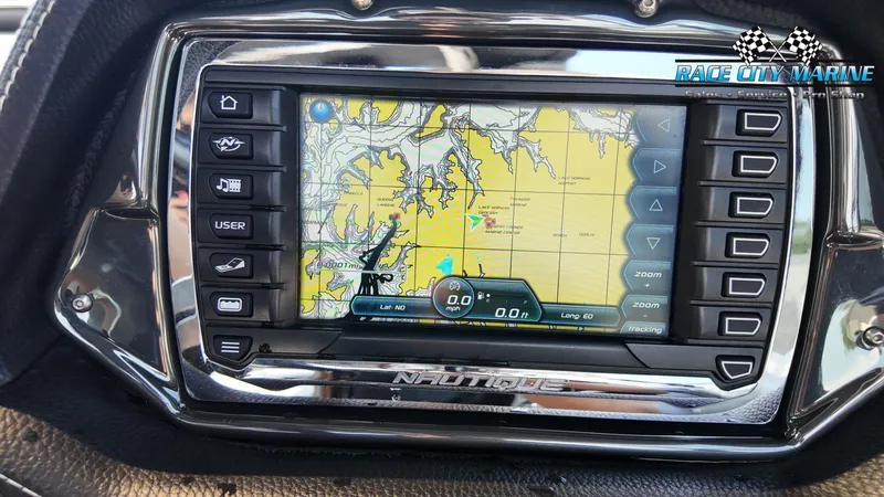 Slide: The Image of A navigation system on a 2013 Nautique G23 boat displays a nautical chart. - 32