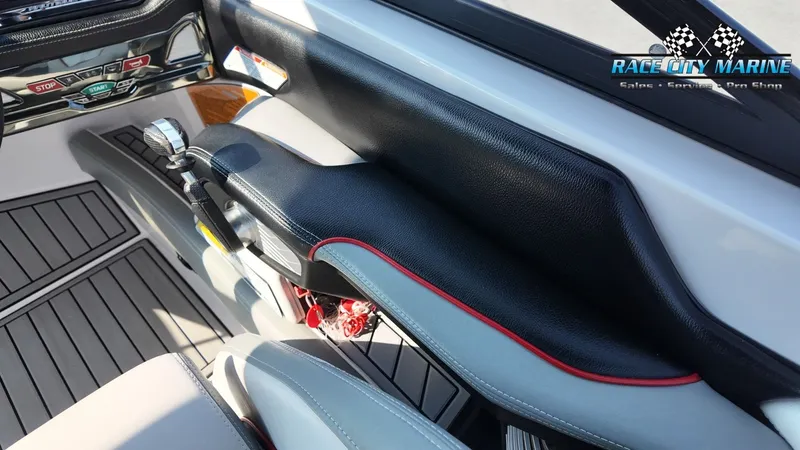 Slide: The Image of The image shows the cockpit of a 2013 Nautique G23 with modern controls. - 27