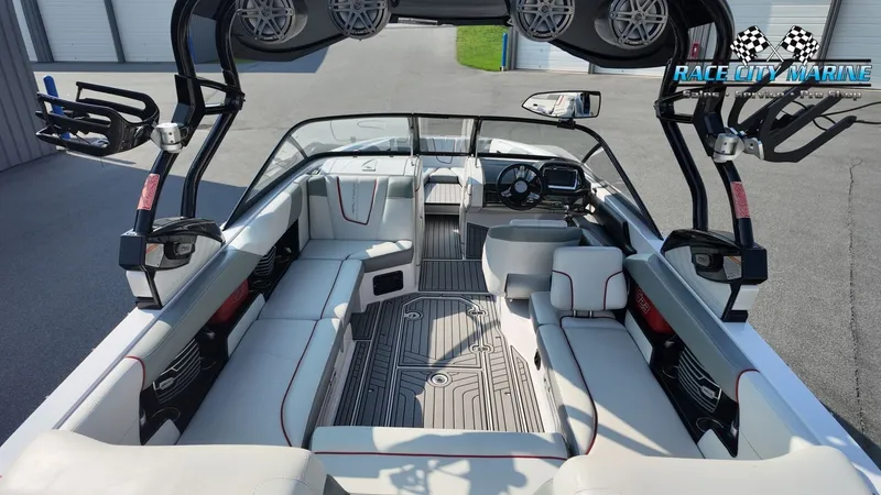 Slide: The Image of The image shows the interior of a 2013 Nautique G23 boat with modern seating and a stylish cockpit. - 42