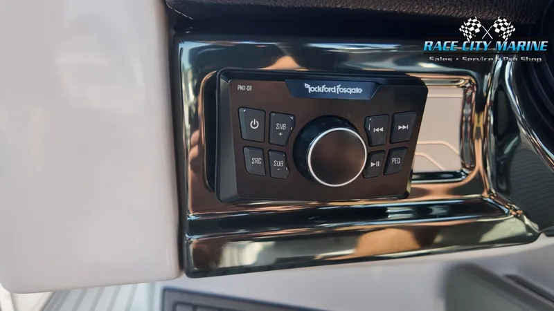 Slide: The Image of Close-up of a Rockford Fosgate audio system in a 2013 Nautique G23 boat. - 35