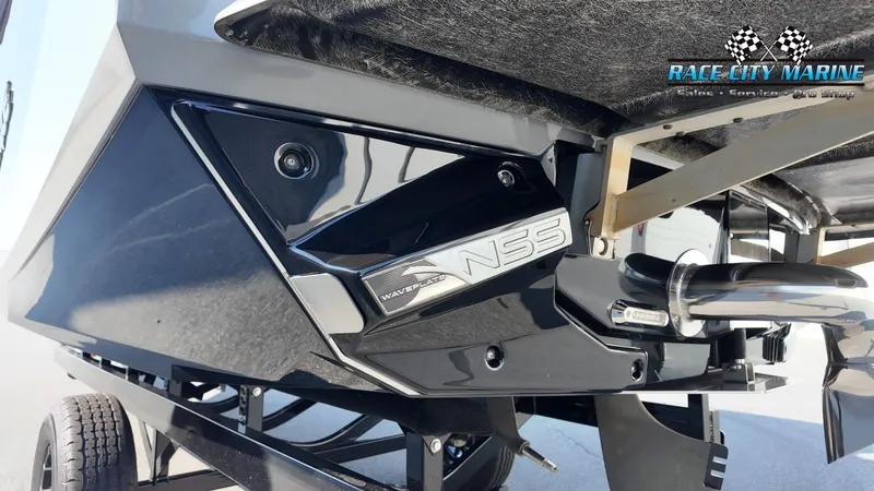 Slide: The Image of Close-up of the rear of a 2013 Nautique G23 featuring the NSS system. - 11