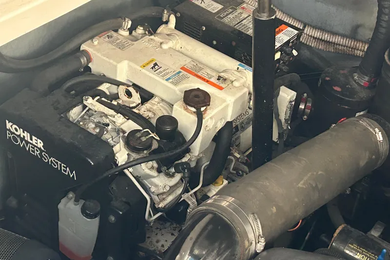 Slide: The Image of Engine compartment of 2003 Sea Ray 340 Sundancer with Kohler power system. - 25
