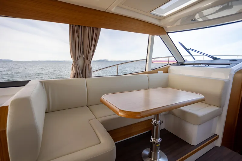 Slide: The Image of Luxurious interior of 2024 Greenline 39 yacht with elegant seating and ocean view. - 14