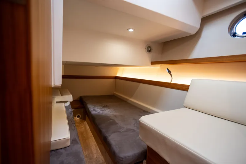 Slide: The Image of 2024 Greenline 39 yacht interior cabin with cozy seating and modern lighting. - 22