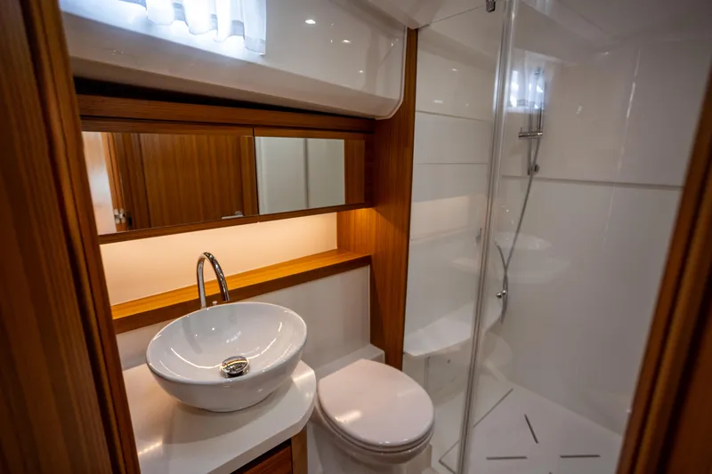 Slide: The Image of Luxurious bathroom in 2024 Greenline 39 yacht with modern fixtures and elegant wood accents. - 23