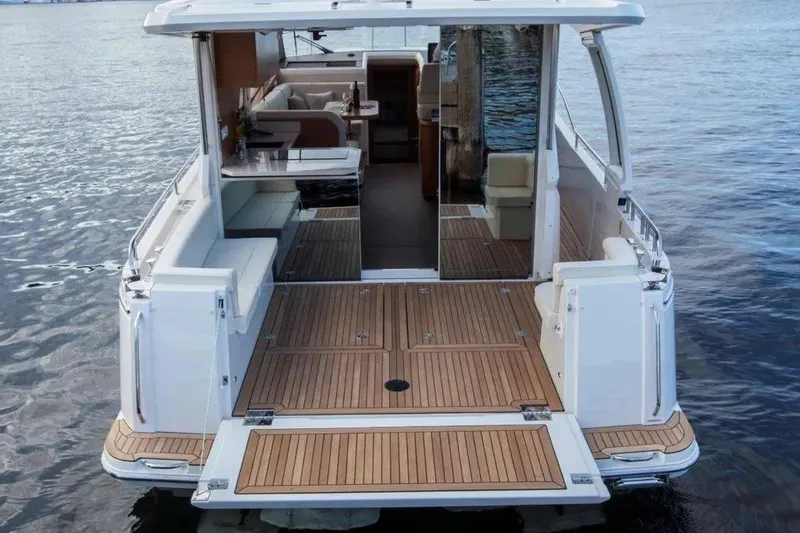 Slide: The Image of 2024 Greenline 39 yacht with open deck, luxurious interior, and scenic water backdrop. - 5