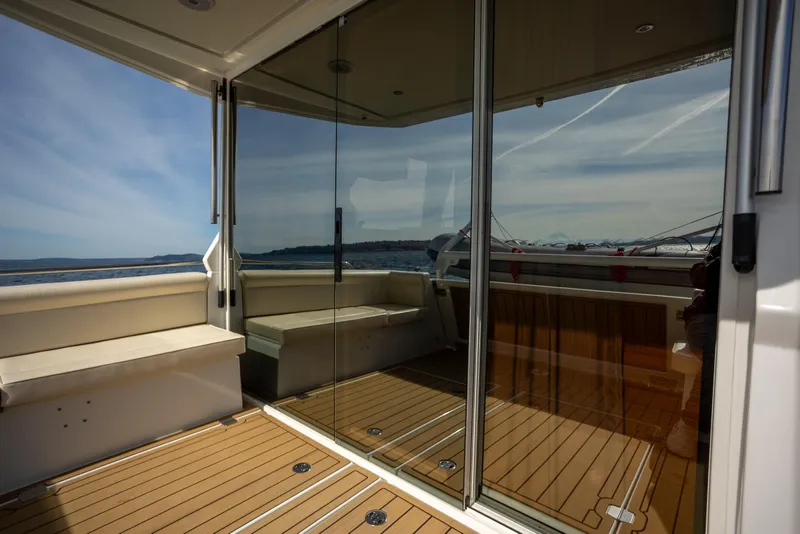 Slide: The Image of Luxurious 2024 Greenline 39 yacht interior with glass doors and ocean view. - 7
