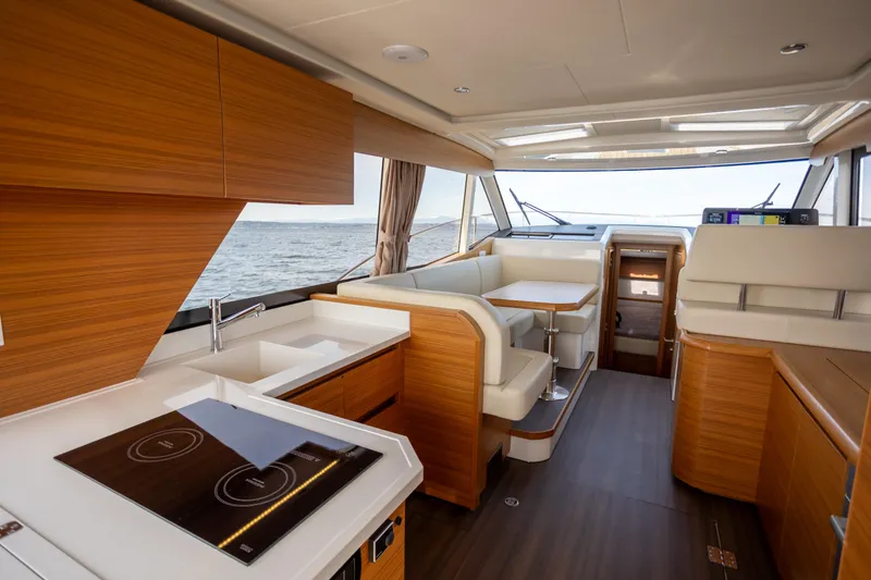Slide: The Image of Luxurious interior of 2024 Greenline 39 yacht with modern kitchen and seating area. - 8