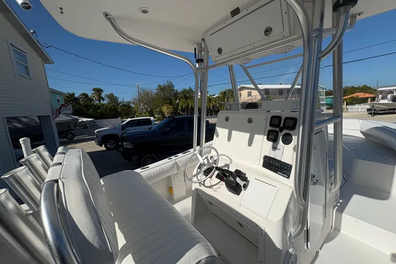 Slide: The Image of 2006 Regulator 24 Classic boat cockpit with steering wheel and control panel. - 11