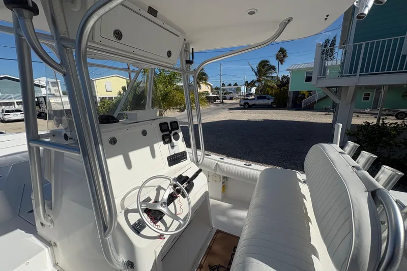 Slide: The Image of 2006 Regulator 24 Classic boat interior with steering wheel and seating. - 12