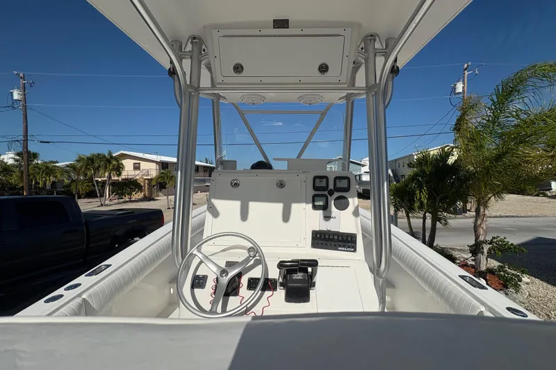Slide: The Image of 2006 Regulator 24 Classic boat interior with steering wheel and control panel. - 13