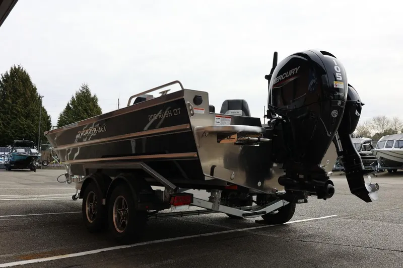 Slide: The Image of 2026 Thunder Jet 209 Rush OT boat with Mercury outboard motor on trailer. - 10