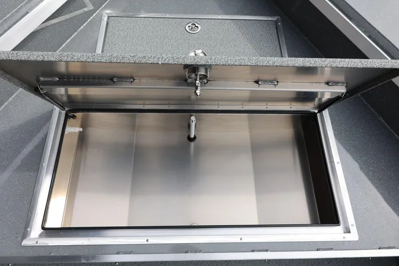 Slide: The Image of Open storage compartment of 2026 Thunder Jet 209 Rush OT boat. - 21
