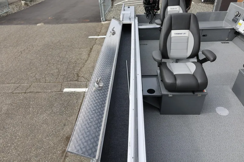 Slide: The Image of 2026 Thunder Jet 209 Rush OT boat interior with seating and storage compartments. - 25