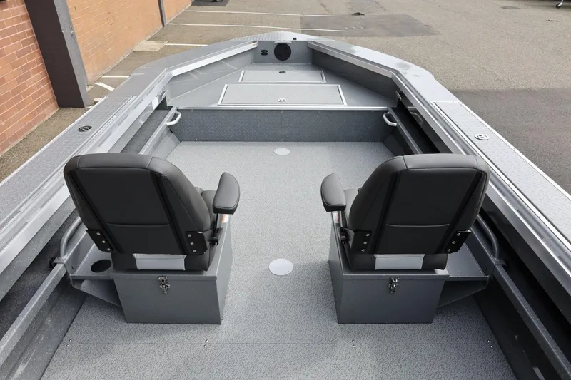 Slide: The Image of 2026 Thunder Jet 209 Rush OT boat interior with two black seats and spacious deck. - 28