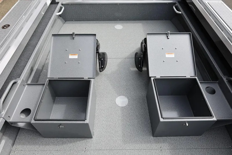 Slide: The Image of Interior view of 2026 Thunder Jet 209 Rush OT boat with open storage compartments. - 29