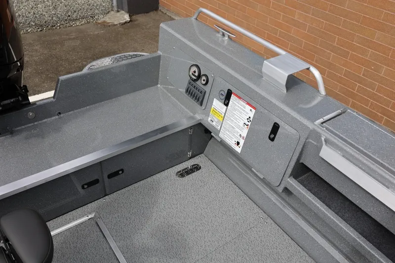 Slide: The Image of Interior view of 2026 Thunder Jet 209 Rush OT boat, showcasing storage and control panel. - 30