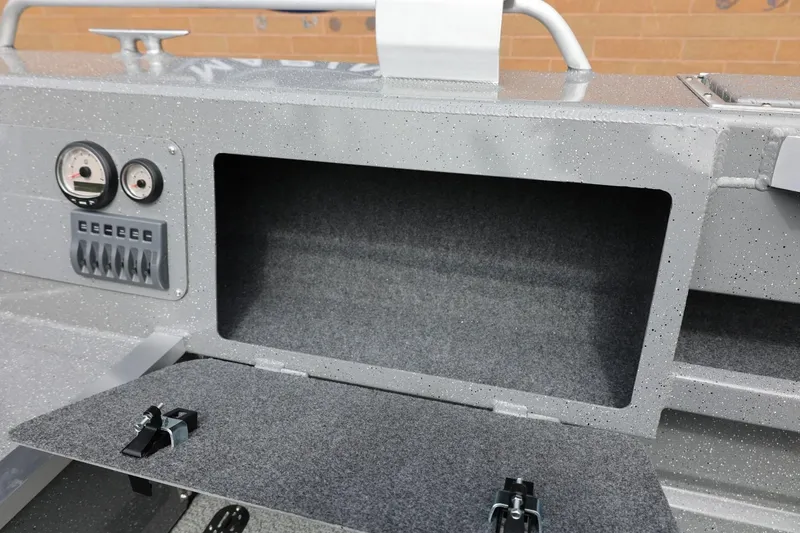 Slide: The Image of Storage compartment and control panel of 2026 Thunder Jet 209 Rush OT boat. - 32
