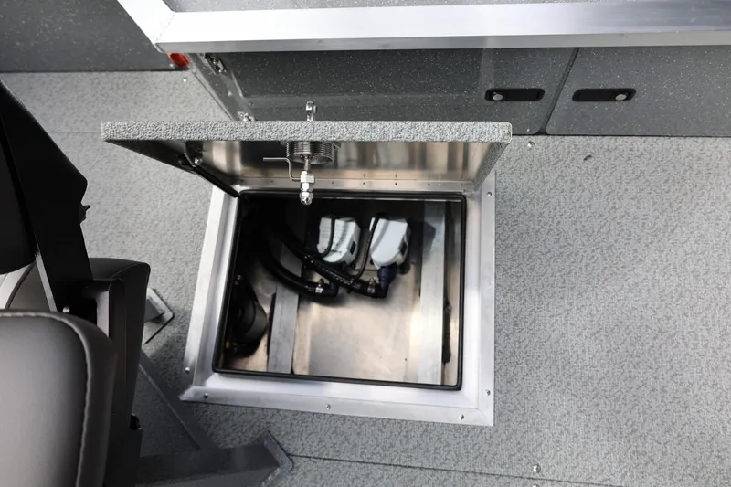 Slide: The Image of Open storage compartment in 2026 Thunder Jet 209 Rush OT boat interior. - 35