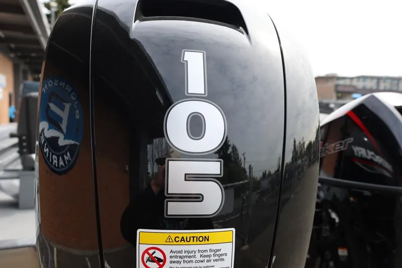 Slide: The Image of Outboard motor with "105" label on a 2026 Thunder Jet 209 Rush OT boat. - 42