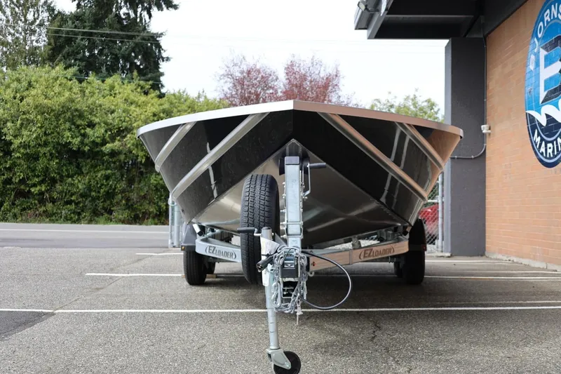 Slide: The Image of 2026 Thunder Jet 209 Rush OT boat on trailer in parking lot. - 6