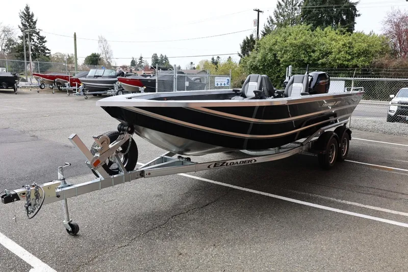 Slide: The Image of 2026 Thunder Jet 209 Rush OT boat on trailer in parking lot. - 7