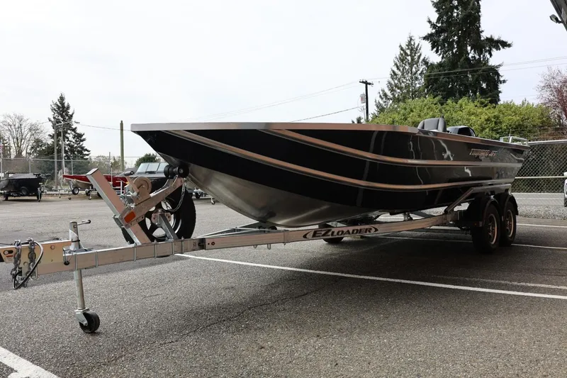 Slide: The Image of 2026 Thunder Jet 209 Rush OT boat on trailer in parking lot. - 8