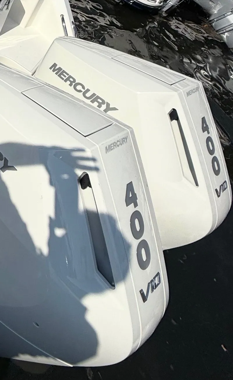 Slide: The Image of 2024 Boston Whaler 325 Conquest with Mercury 400 V10 engines. - 2