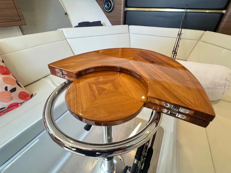Slide: The Image of Luxurious interior of 2024 Boston Whaler 325 Conquest with wooden table. - 22