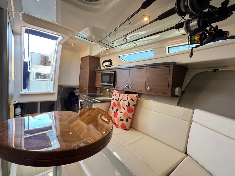 Slide: The Image of Interior of 2024 Boston Whaler 325 Conquest featuring modern kitchen. - 23