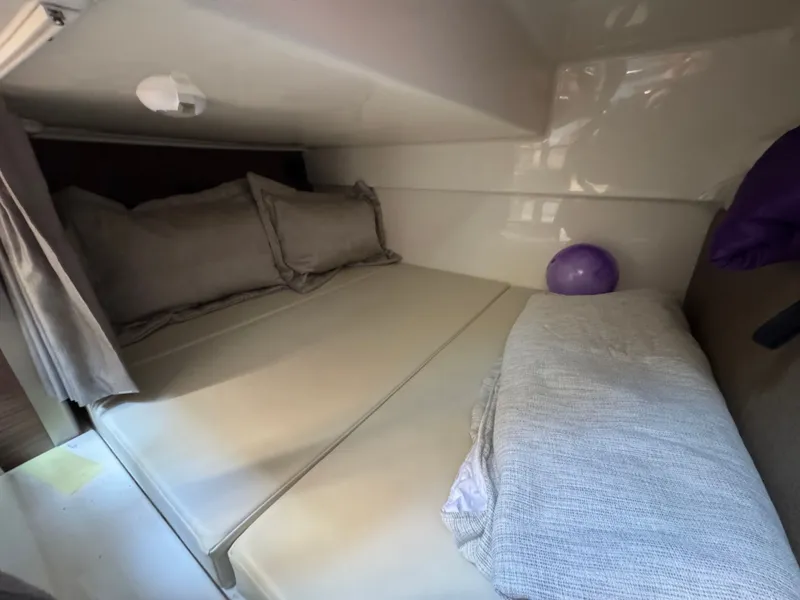 Slide: The Image of Elegant wooden table in the interior of the 2024 Boston Whaler 325 Conquest. - 25