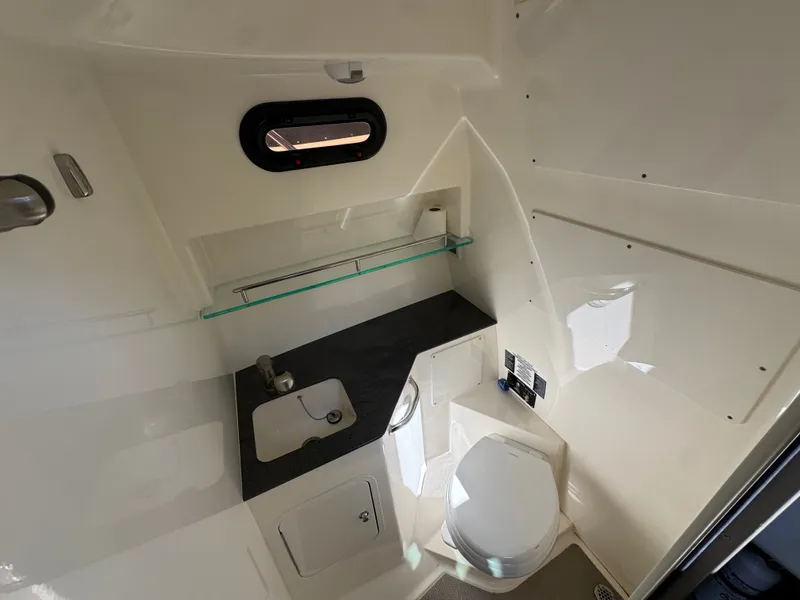 Slide: The Image of Interior of 2024 Boston Whaler 325 Conquest with cozy bed. - 26