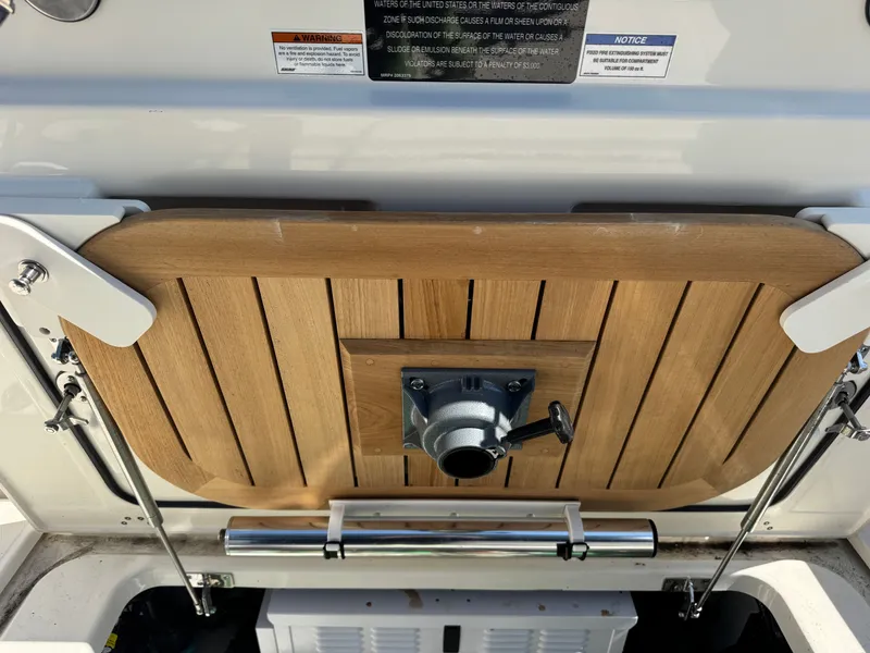 Slide: The Image of Interior of 2024 Boston Whaler 325 Conquest with helm station. - 32