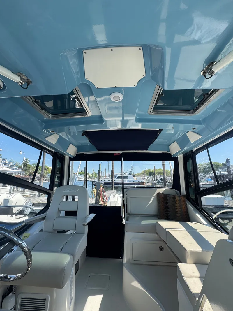 Slide: The Image of Interior of 2024 Boston Whaler 325 Conquest with seating area. - 4
