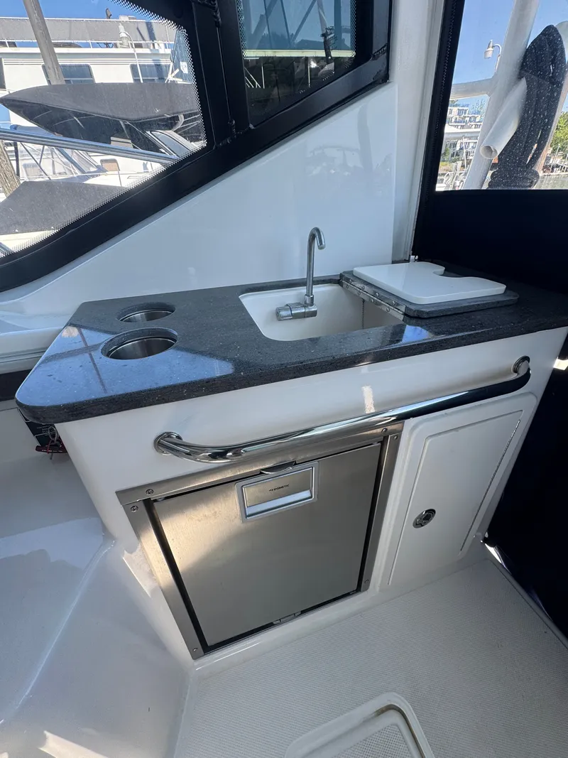 Slide: The Image of Galley area on a 2024 Boston Whaler 325 Conquest boat. - 9