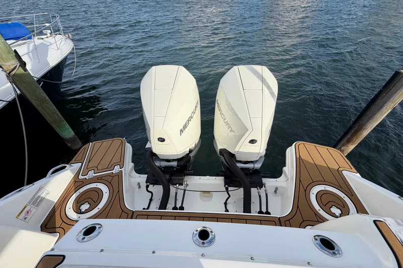 Slide: The Image of 2022 Boston Whaler 280 Vantage with twin Mercury outboard engines on water. - 11